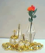 CLEAR PERFUME BOTTLES ON GOLD TRAY